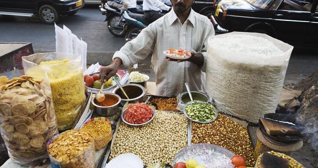 A vendor sells Bhelpuri on the streets of Mumbai.